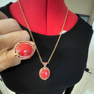 Costume jewelry set. Red tone stones on rose gold tone chain.
